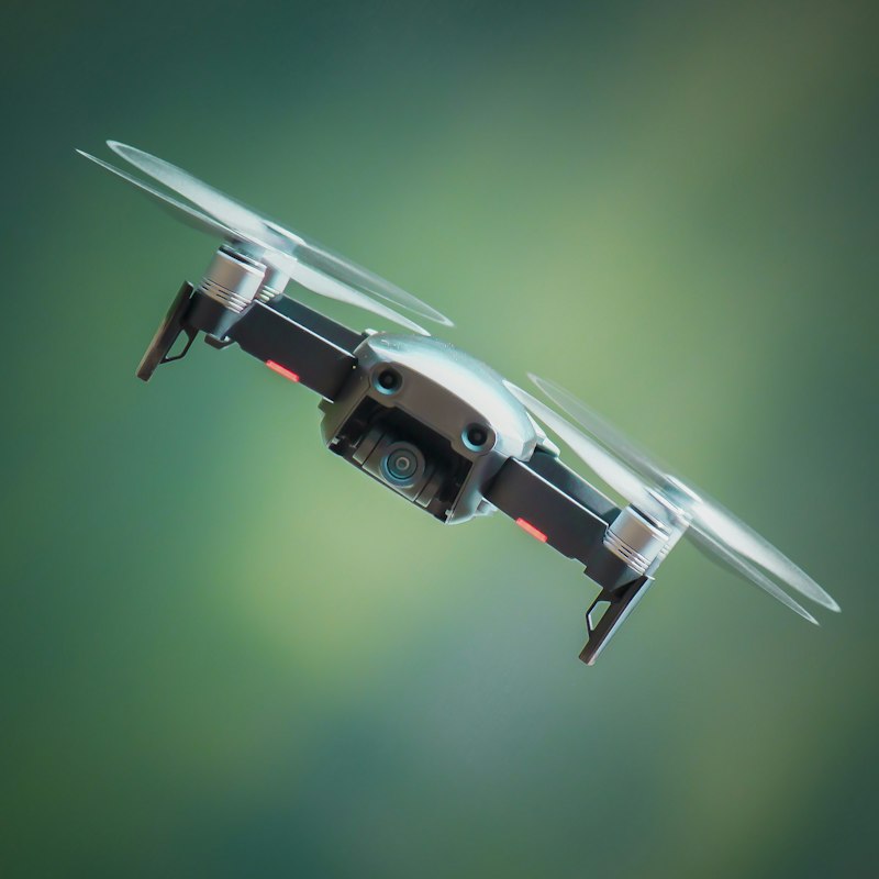 Modern FPV quadcopter drone with remote transmitter controller